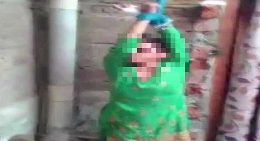 Still image from the video of man beating wife for dowry Still image from the video of man beating wife for dowry