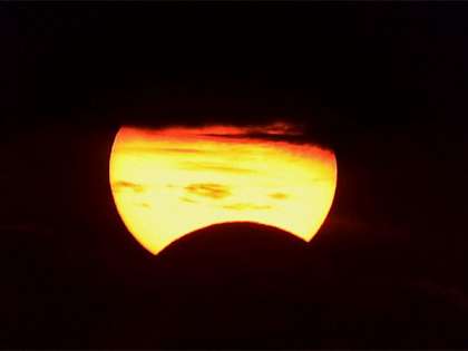 Partial solar eclipse takes place when the sun, moon, and Earth are almost lined up with each other Partial solar eclipse takes place when the sun, moon, and Earth are almost lined up with each other