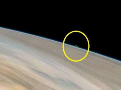 Mysterious green UFO hovering very close to the surface of Jupiter Mysterious green UFO hovering very close to the surface of Jupiter