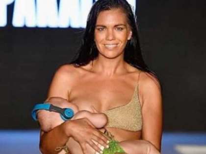 Model breastfeeds five-month-old during ramp walk Model breastfeeds five-month-old during ramp walk