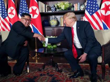 Donald Trump with Kim Jong-un during a summit Donald Trump with Kim Jong-un during a summit